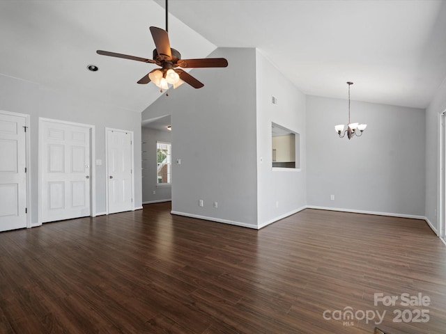 9404 S Vicksburg Park Ct, Charlotte, NC 28210 - unfurnished living room with lofted ceiling, ceiling fan, a chandelier, baseboards, and dark wood finished floors