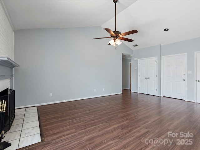 9404 S Vicksburg Park Ct, Charlotte, NC 28210 - unfurnished living room featuring a ceiling fan, wood finished floors, a brick fireplace, and high vaulted ceiling