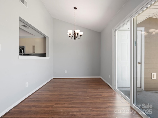 9404 S Vicksburg Park Ct, Charlotte, NC 28210 - unfurnished dining area with wood finished floors, a chandelier, vaulted ceiling, and baseboards