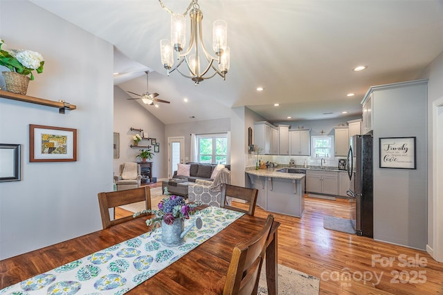 2146 Derby Ct, Morganton, NC 28655 - dining space featuring healthy amount of natural light, a ceiling fan, a chandelier, light wood finished floors, and recessed lighting