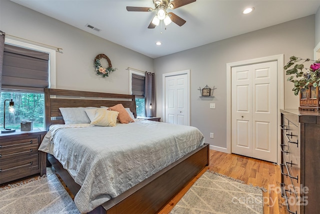 2146 Derby Ct, Morganton, NC 28655 - bedroom with light wood-style flooring, recessed lighting, two closets, ceiling fan, and baseboards