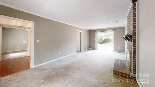 2507 Birnen Dr, Charlotte, NC 28210 - unfurnished living room featuring crown molding, a brick fireplace, baseboards, carpet flooring, and a textured ceiling