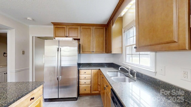 2507 Birnen Dr, Charlotte, NC 28210 - kitchen with stainless steel appliances, a sink, light tile patterned flooring, dark stone countertops, and ornamental molding