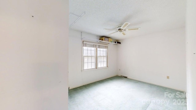 2507 Birnen Dr, Charlotte, NC 28210 - empty room featuring ceiling fan, light colored carpet, and a textured ceiling