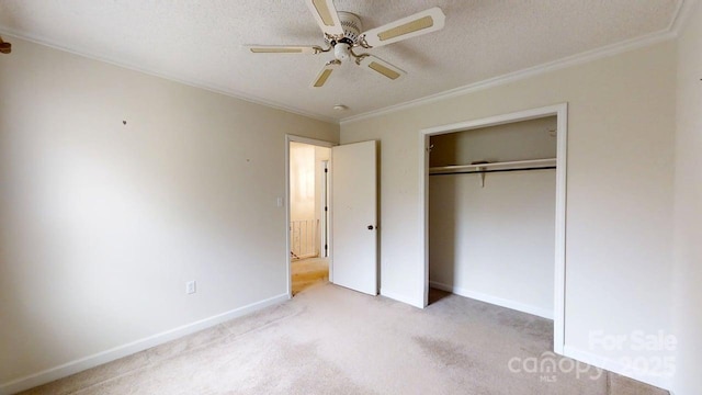 2507 Birnen Dr, Charlotte, NC 28210 - unfurnished bedroom featuring carpet floors, crown molding, baseboards, a closet, and a textured ceiling