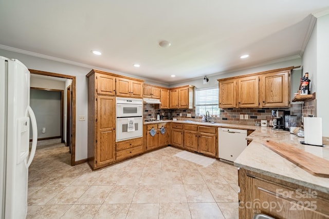 8698 Rocky River Rd, Harrisburg, NC 28075 - kitchen with white appliances, a sink, ornamental molding, decorative backsplash, and light stone counters