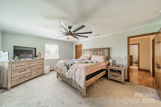 8698 Rocky River Rd, Harrisburg, NC 28075 - bedroom featuring light colored carpet, crown molding, baseboards, and ceiling fan