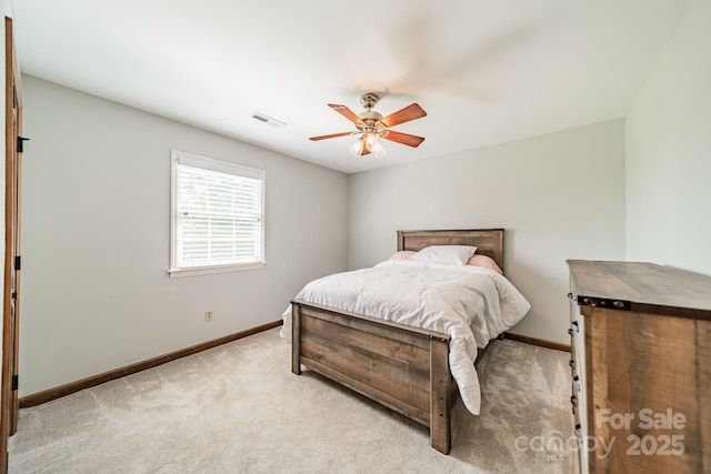 8698 Rocky River Rd, Harrisburg, NC 28075 - bedroom featuring baseboards, light colored carpet, and a ceiling fan