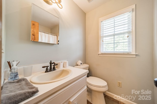 8698 Rocky River Rd, Harrisburg, NC 28075 - full bath with vanity, toilet, and tile patterned flooring