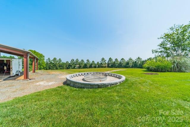 8698 Rocky River Rd, Harrisburg, NC 28075 - view of green lawn with an outdoor fire pit