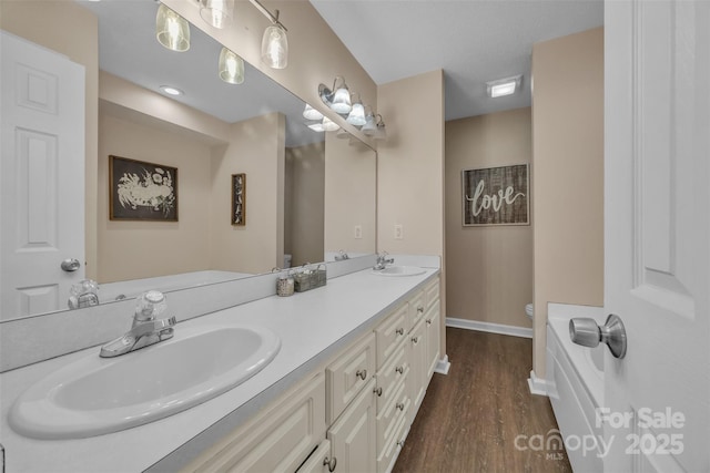 350 Moose Dr, Stony Point, NC 28678 - full bath with toilet, double vanity, wood finished floors, and baseboards