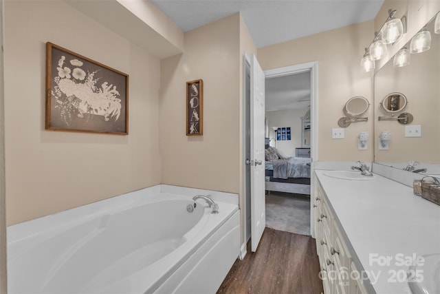 350 Moose Dr, Stony Point, NC 28678 - full bath with connected bathroom, a bath, vanity, and wood finished floors