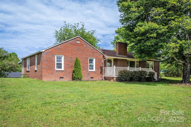 175 Duke St, Granite Falls, NC 28630 - back of house featuring crawl space, a chimney, brick siding, and a yard