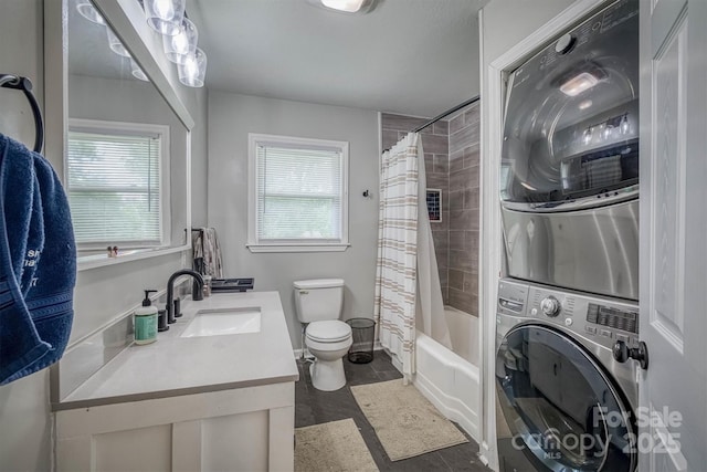 826 Jamestown Rd, Morganton, NC 28655 - full bath featuring stacked washer / dryer, toilet, plenty of natural light, and vanity