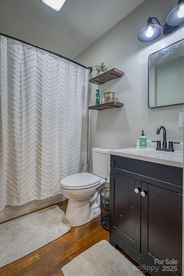 826 Jamestown Rd, Morganton, NC 28655 - bathroom featuring toilet, wood finished floors, vanity, and a shower with curtain