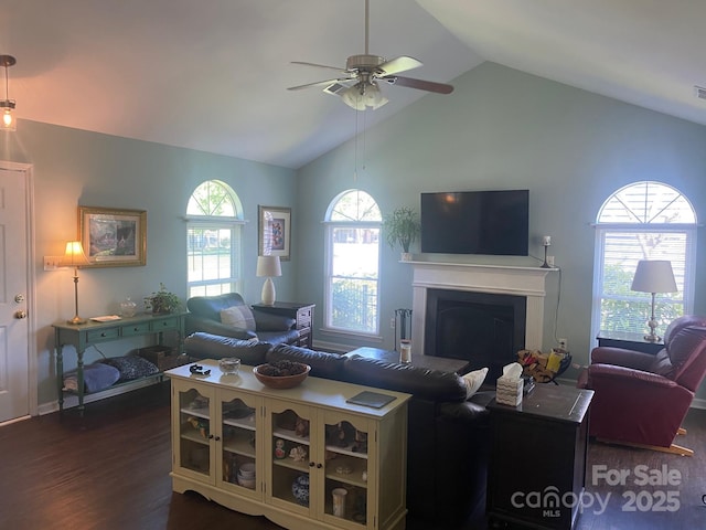 9612 Farmridge Ln, Matthews, NC 28105 - living room featuring dark wood-style floors, ceiling fan, a fireplace, and high vaulted ceiling