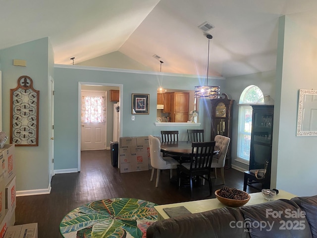 9612 Farmridge Ln, Matthews, NC 28105 - dining area featuring vaulted ceiling, dark wood-style floors, and baseboards