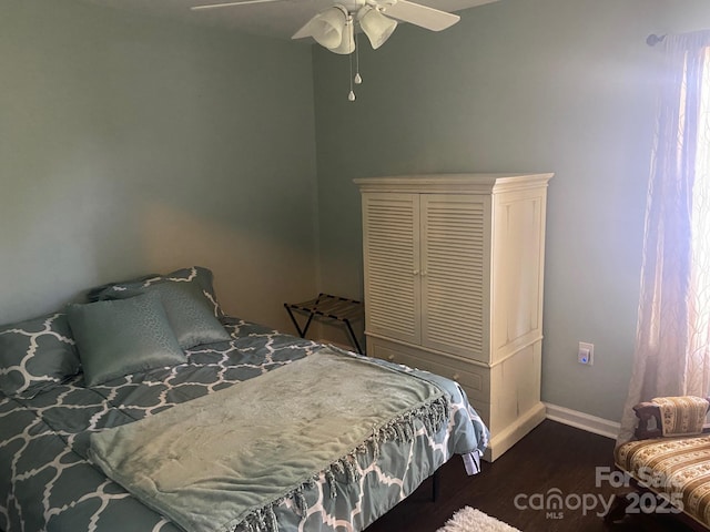9612 Farmridge Ln, Matthews, NC 28105 - bedroom featuring baseboards, wood finished floors, and ceiling fan