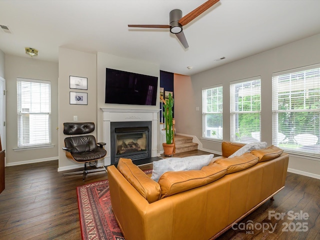 10639 Secret Garden Ln, Charlotte, NC 28214 - living area with plenty of natural light, a fireplace with flush hearth, baseboards, and ceiling fan