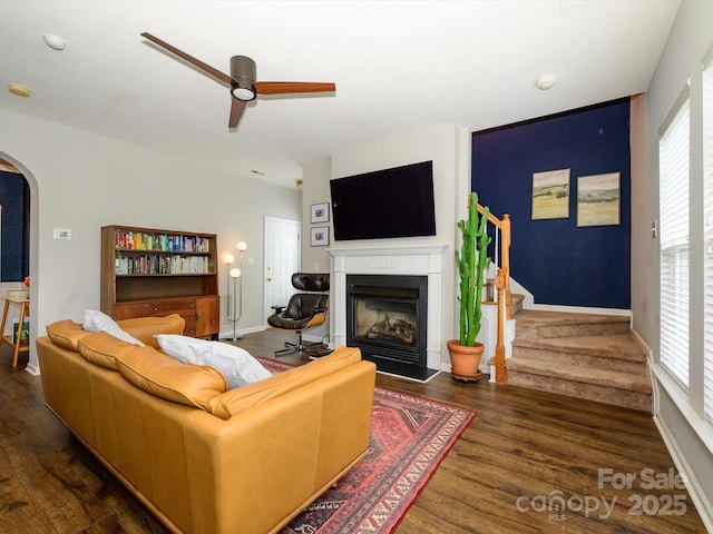10639 Secret Garden Ln, Charlotte, NC 28214 - living area featuring a fireplace with raised hearth, wood finished floors, healthy amount of natural light, and stairway