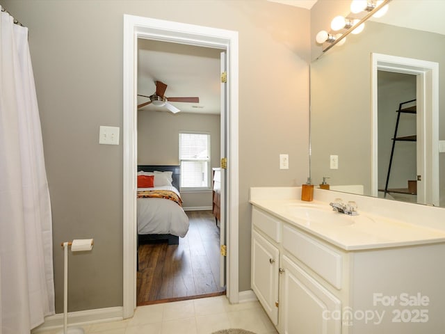 10639 Secret Garden Ln, Charlotte, NC 28214 - ensuite bathroom with vanity, a ceiling fan, baseboards, and curtained shower