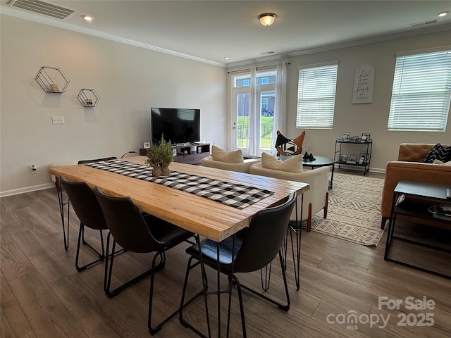 1016 Laggan Ln, Indian Trail, NC 28079 - dining area with ornamental molding, dark wood-type flooring, baseboards, and recessed lighting