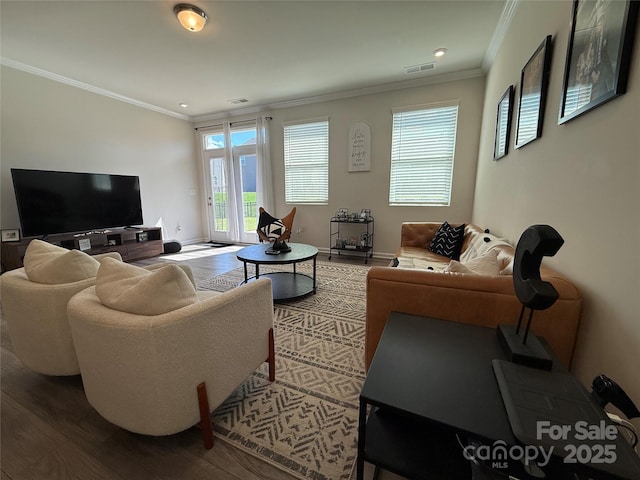 1016 Laggan Ln, Indian Trail, NC 28079 - living area featuring wood finished floors, crown molding, baseboards, and recessed lighting