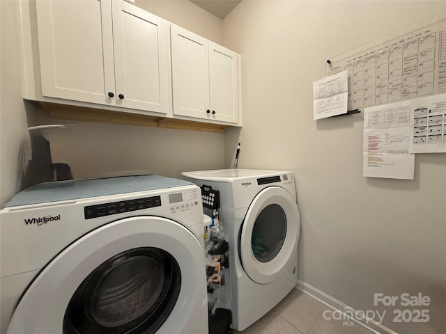 1016 Laggan Ln, Indian Trail, NC 28079 - laundry area with cabinet space, independent washer and dryer, light tile patterned floors, and baseboards