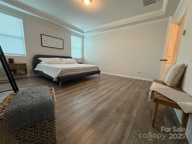 1016 Laggan Ln, Indian Trail, NC 28079 - bedroom with a raised ceiling, wood finished floors, baseboards, and crown molding