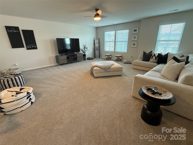 1016 Laggan Ln, Indian Trail, NC 28079 - living room featuring ceiling fan, carpet flooring, and baseboards