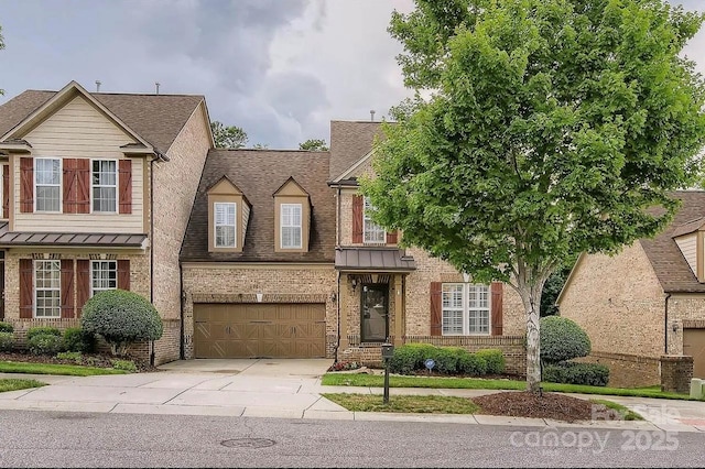 2234 Donnington Ln NW, Concord, NC 28027 - traditional home featuring brick siding, driveway, a garage, and a standing seam roof