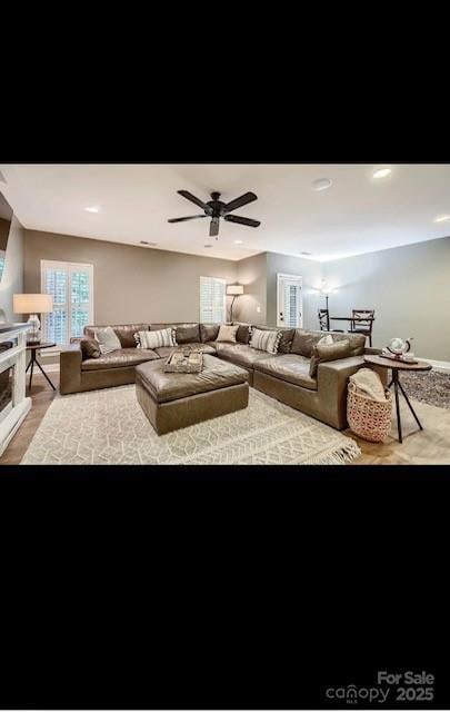 2234 Donnington Ln NW, Concord, NC 28027 - living room with a ceiling fan and light wood-type flooring