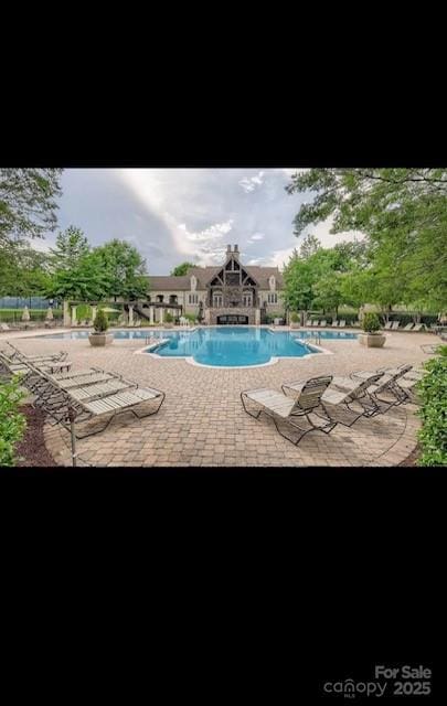 2234 Donnington Ln NW, Concord, NC 28027 - community pool featuring a patio