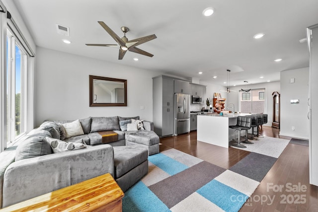 919 Cityscape Dr, Charlotte, NC 28205 - living area with ceiling fan, recessed lighting, and dark wood-type flooring