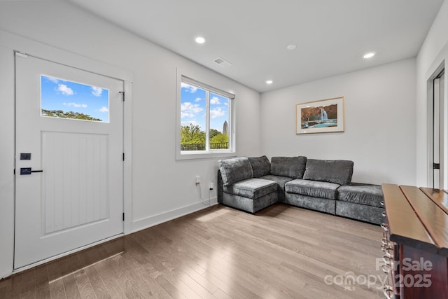 919 Cityscape Dr, Charlotte, NC 28205 - living room with wood finished floors, recessed lighting, and baseboards
