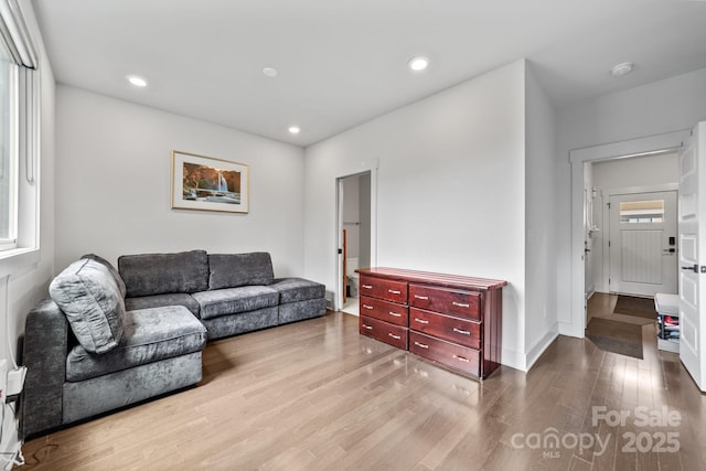 919 Cityscape Dr, Charlotte, NC 28205 - living room with wood finished floors, recessed lighting, and baseboards
