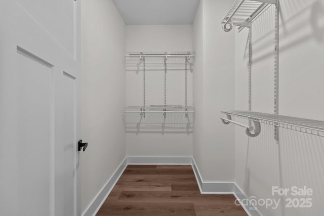 2220 Mooresville Rd, Salisbury, NC 28147 - walk in closet with dark wood-style floors