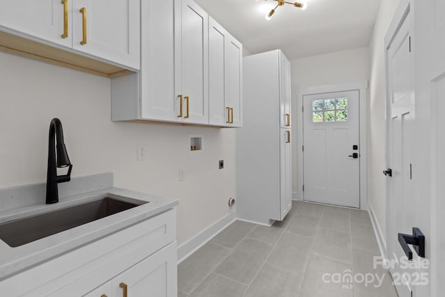 2220 Mooresville Rd, Salisbury, NC 28147 - laundry area with hookup for an electric dryer, cabinet space, washer hookup, baseboards, and light tile patterned floors