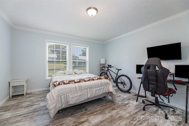 503 Apple St, Gibsonville, NC 27249 - bedroom with ornamental molding, wood finished floors, baseboards, and an office area