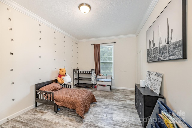 503 Apple St, Gibsonville, NC 27249 - bedroom with a textured ceiling, ornamental molding, light wood finished floors, and baseboards