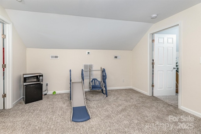 503 Apple St, Gibsonville, NC 27249 - workout area featuring carpet floors, vaulted ceiling, and baseboards