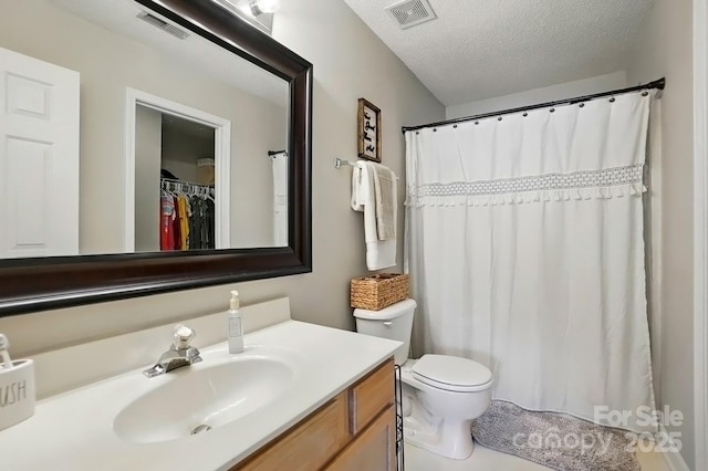820 Settlement St, Clover, SC 29710 - bathroom featuring vanity, a textured ceiling, toilet, and a shower with curtain