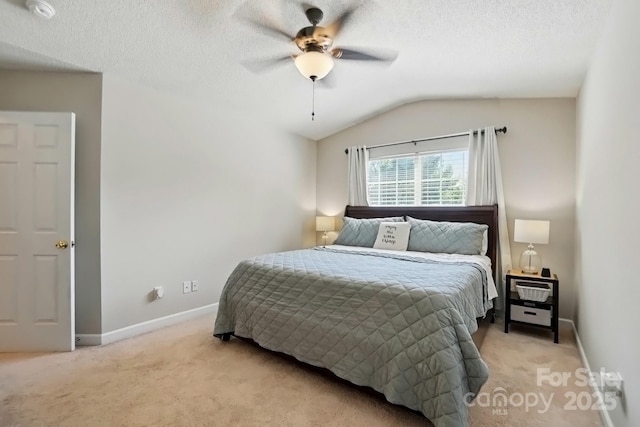 820 Settlement St, Clover, SC 29710 - bedroom with light carpet, vaulted ceiling, a textured ceiling, and a ceiling fan