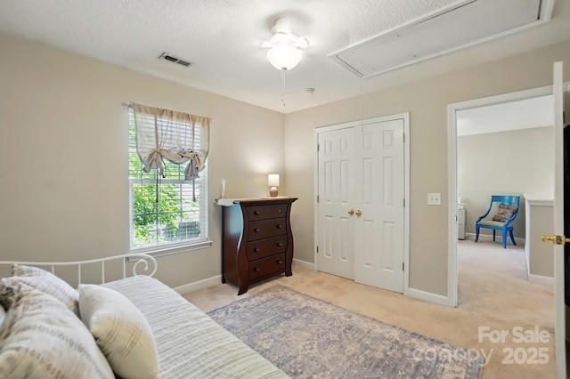 820 Settlement St, Clover, SC 29710 - bedroom featuring attic access, light colored carpet, a closet, and a textured ceiling