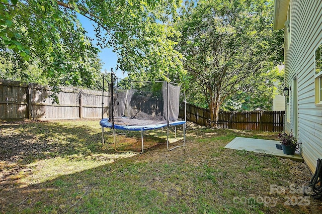 820 Settlement St, Clover, SC 29710 - fenced backyard featuring a trampoline and a patio area