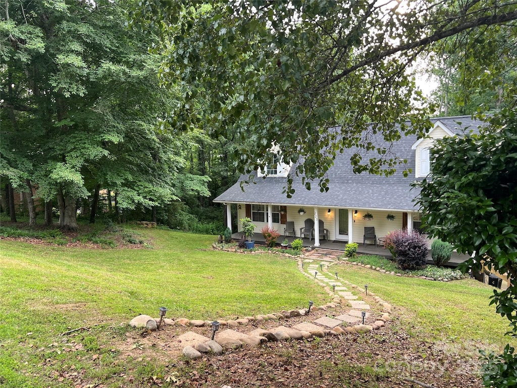 223 Tennessee Trl, Lincolnton, NC 28092 - view of front of property featuring covered porch, a front lawn, and a shingled roof
