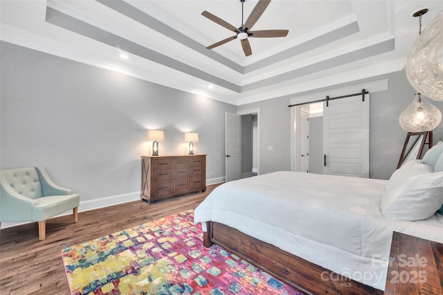 1622 Hunters Place Rd, York, SC 29745 - bedroom featuring a barn door, wood finished floors, ornamental molding, a raised ceiling, and recessed lighting