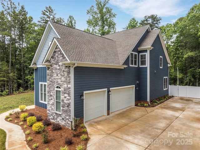 1622 Hunters Place Rd, York, SC 29745 - view of property exterior with stone siding, roof with shingles, and concrete driveway