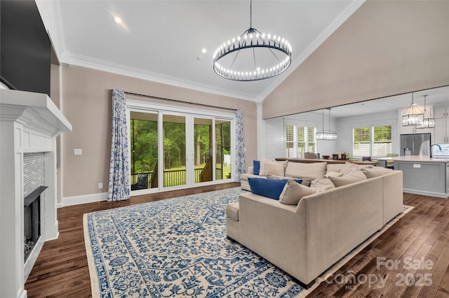 1622 Hunters Place Rd, York, SC 29745 - living room featuring a chandelier, a fireplace, dark wood finished floors, ornamental molding, and high vaulted ceiling