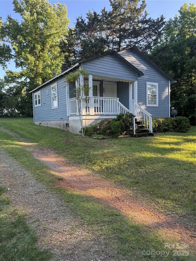 241 Hamrick Dr, Ellenboro, NC 28040 - view of front of property featuring a porch and a front lawn